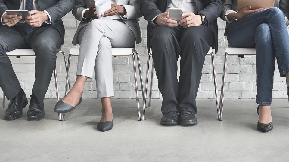 employees sitting on chairs talking