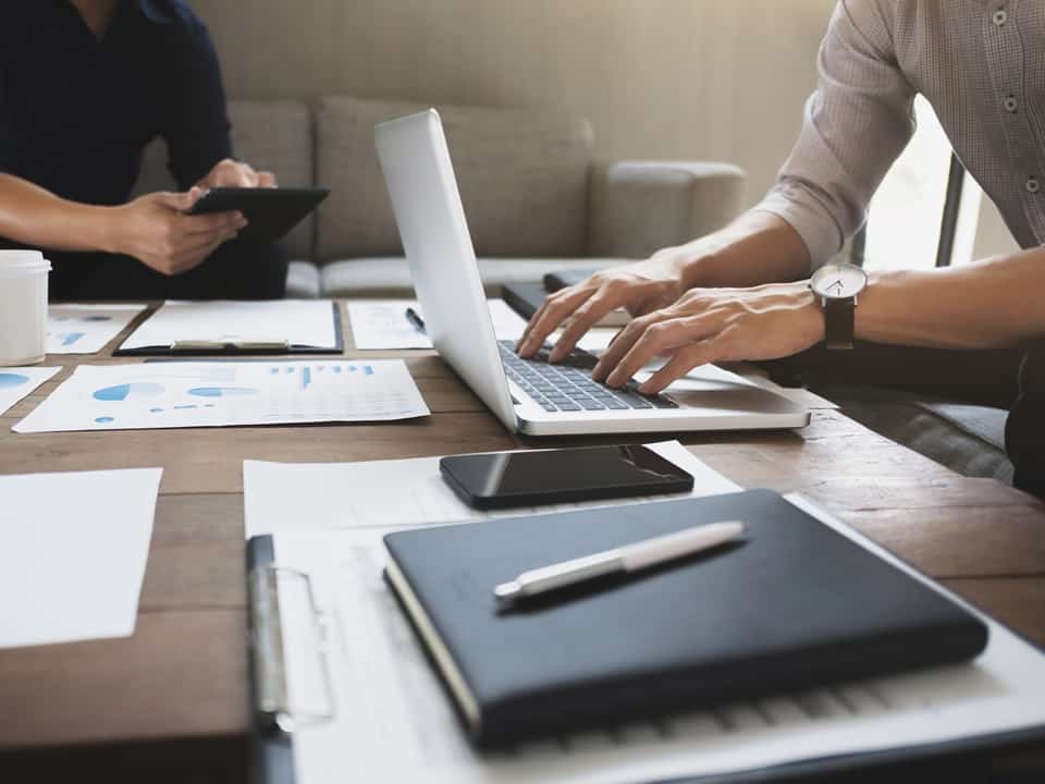 consultants around a computer